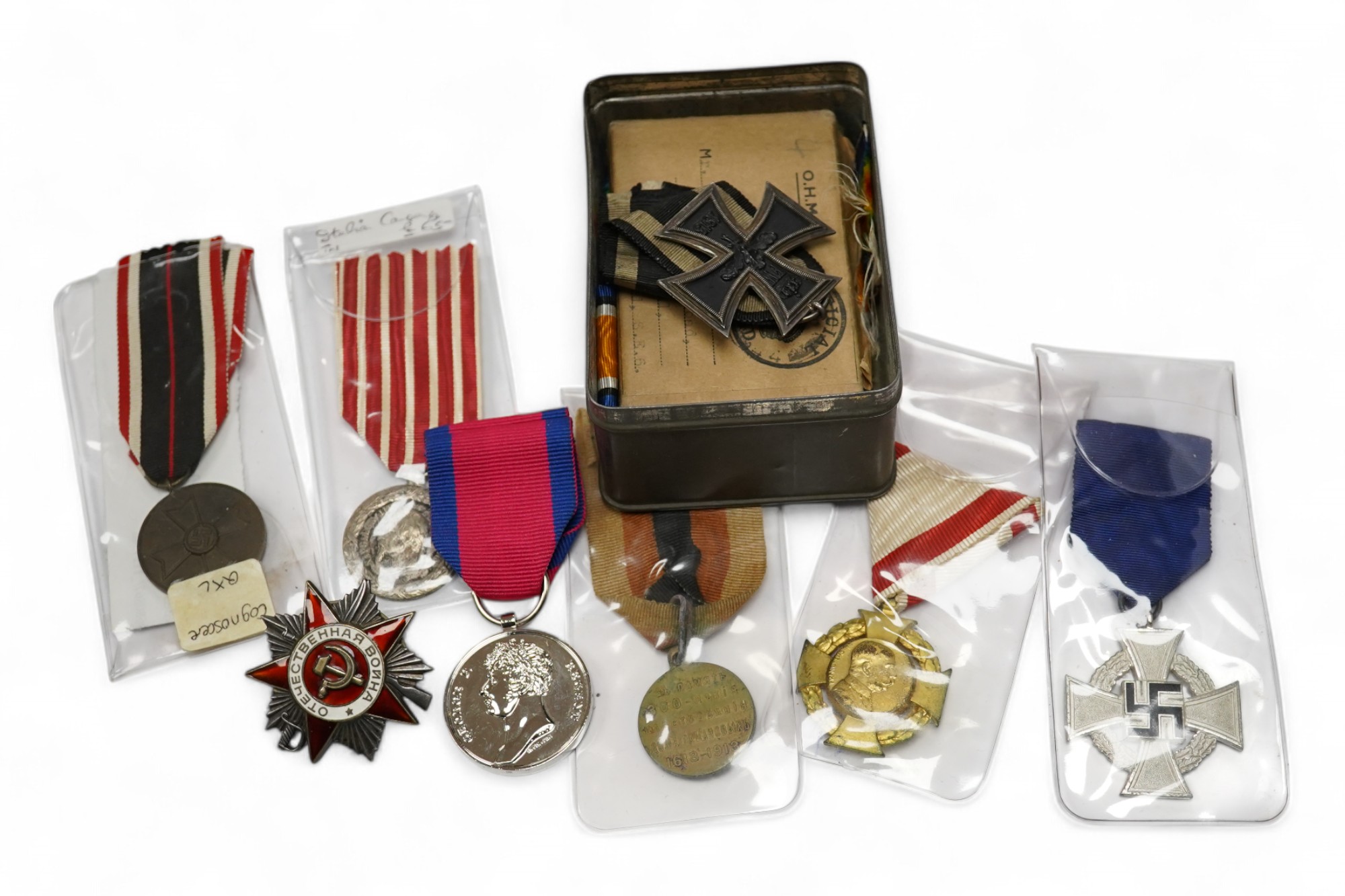 Fifteen British, German, etc. military medals including; a First World War medal pair to DVR. A.E. Hooker. R.A., a boxed WWII Defence Medal, a 1914 Second Class Iron Cross, a France Italian Campaign medal, a 1939 German